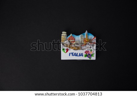 Souvenir - Fridge magnet from Italy on black background