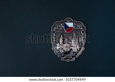 Souvenir - Fridge magnet from Prague, Czech on black background