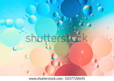 a combination of oil and water, a fantastic abstract macro background with blur elements and motion along the perimeter of the frame