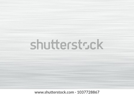 Brushed  silver metal texture. Polished metal texture background with light reflection.