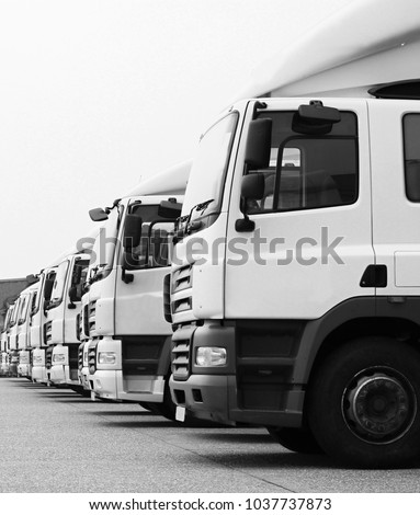 lorries parked up outside a company's car parking area no people stock photo Royalty-Free Stock Photo #1037737873