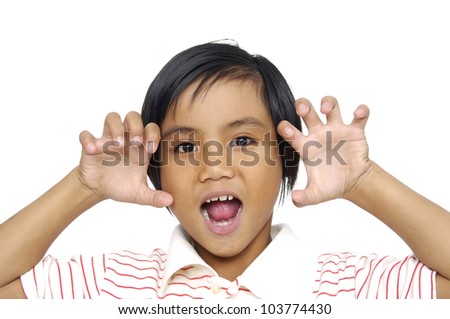 Little girl making a funny face with both hands