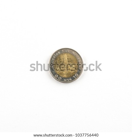 Thai 10-baht coin on a white surface