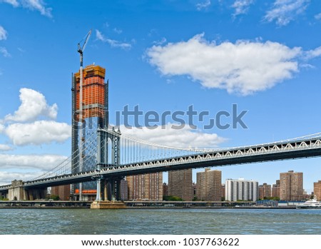 Manhattan Bridge, as seen from Brooklyn, with  Manhattan skyline in the background.  New York City, USA 