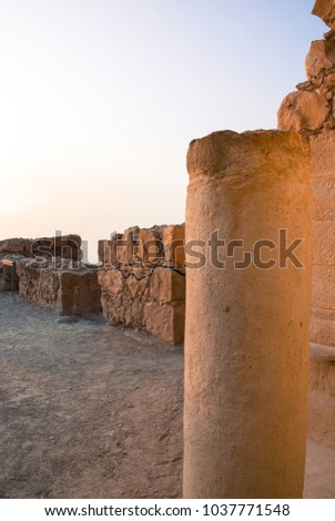 Vertical picture of the ruins of ancient fortress of Massada on the mountain in Israel