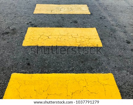 Yellow zebra lines/ pedestrian crossing is designated by two parallel yellow lines drawn across a road at a junction or an intersection