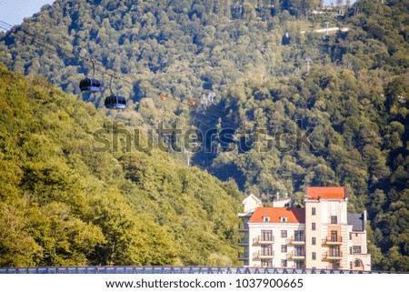 Image of buildings at foot of mountains