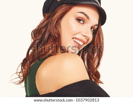 Portrait of young stylish laughing girl model in black casual summer clothes in cap with natural makeup isolated on white background. Looking at camera
