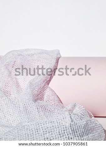 Abstract background in white and light pink. Copy space. Net fabric.       