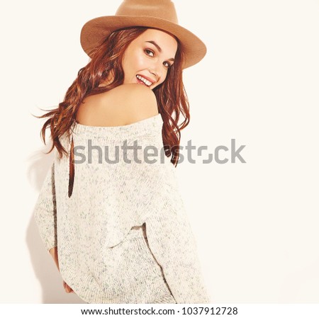 Portrait of young stylish girl model in casual summer clothes in brown hat with natural makeup isolated on white background. Looking at camera