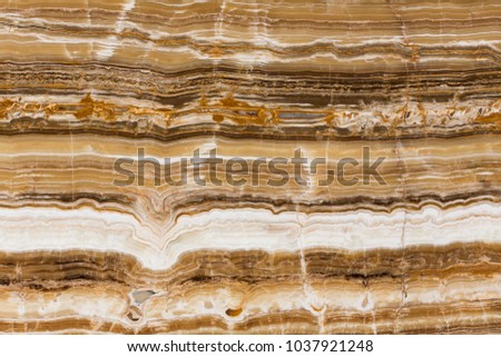 Beige onyx marble decorative stone texture with abstract lines. High resolution photo.