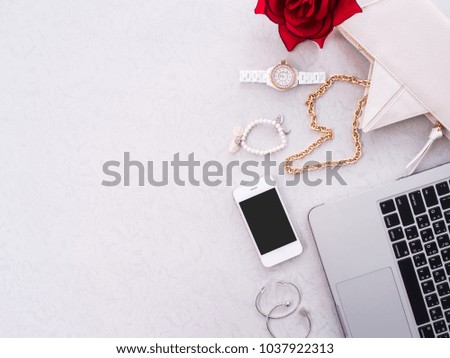 Fashion concept, Trendy fashion Handbag, Gold Shoes, laptop and smartphone, Woman  Accessories on gray background with copy space.