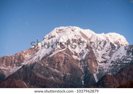 Snow-covered Annapurna mountain in the starry sky. Nepal, Himalayas