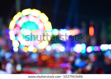 Ferris wheel light bokeh with dark background.