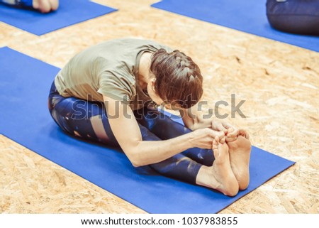 girl doing yoga in the hall