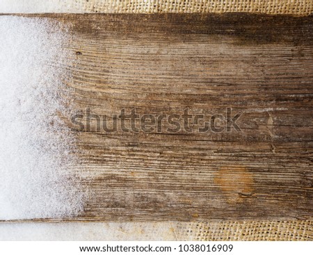 background. white snowflakes on an old wooden Board