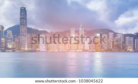 Hong Kong night light business building over Victoria bay, cityscape downtown background