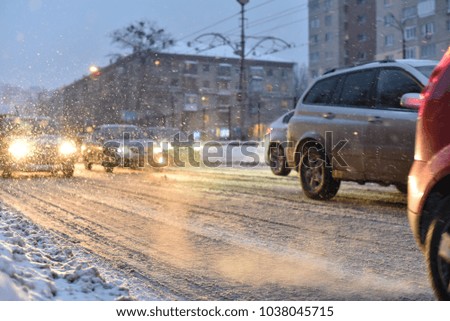 cars in smoke of traffic jam of winter storm
