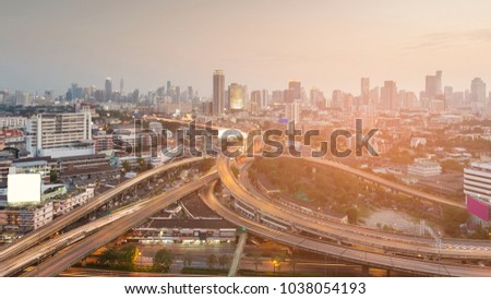 Highway interchange in city business downtown, cityscape background