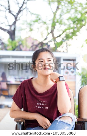 Young asian business women with smart watch and cellphone sitting in corporate