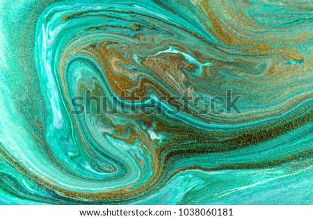 Marble abstract acrylic background. Nature green marbling artwork texture. Golden glitter. Royalty-Free Stock Photo #1038060181