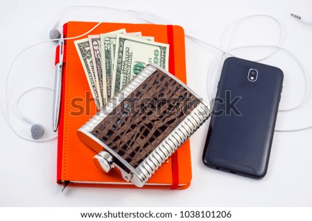 Notepad with pen, money, flask with whiskey and mobile phone. Men's accessories. Set of business men on a white background.