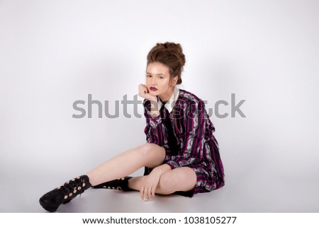 portrait of the beautiful young woman, dreams about something, he thinks, smiling on a white background
