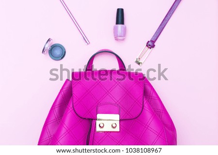 Cosmetics and accessories on a pink background