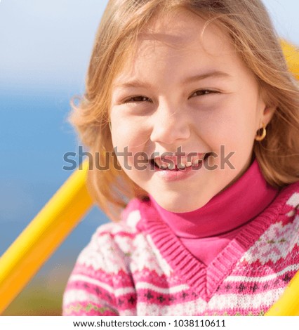 Portrait Of Small Blonde Girl, Outdoors
