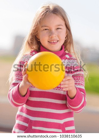 Little Blonde Girl Playing With Ball, Outdoors