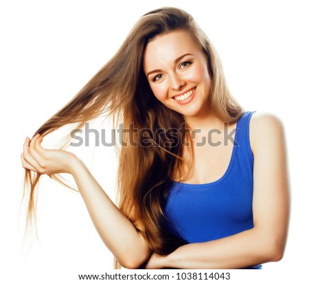 young blond woman on white backgroung smiling gesture thumbs up,