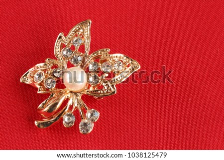holiday jewelry on red textile background  