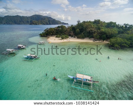 CYC beach in Coron, Palawan, Philippines. Corn Youth Club Beach. Mountain and Sea in background. Tour A.