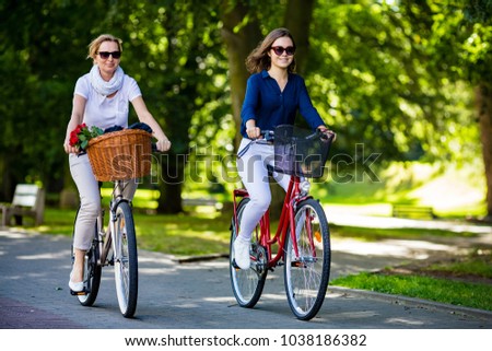 Women biking in city