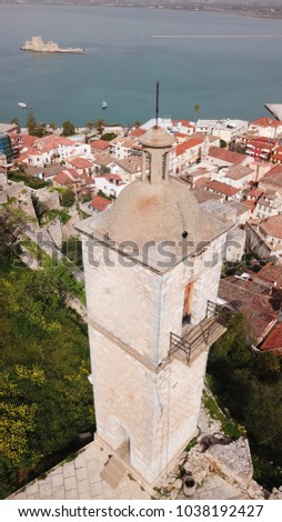 Aerial drone photo from picturesque and famous clock tower in fortress of Acronafplia with views to iconic city of Nafplio and Bourtzi, Argolida, Peloponnese 