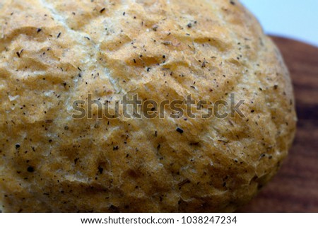 Bread background - close up of garlic and coriander. Bread with herbs.