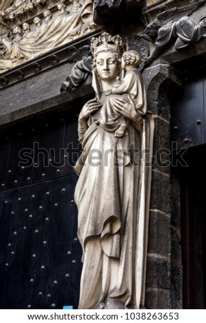 A white statue of maddona and baby on a wall in Sint-Janshospitaal Brugge, Belgium, Europe on a bright sunny  day