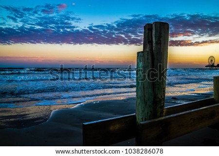Low tide on Galveston beach. Royalty-Free Stock Photo #1038286078