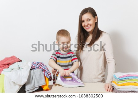 Little boy, woman ironing family clothing on ironing board with iron. Son help mother with housework isolated on white background. Encouraging Autonomy in children concept. Parenthood, child concept