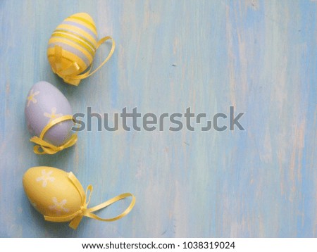 Easter picture colored egg on blue wooden background