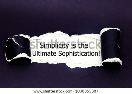 Motivational quote Simplicity is the Ultimate Sophistication, appearing behind torn paper. 