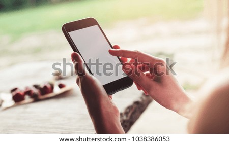Girl's hands taking photo of breakfast by smartphone. Healthy breakfast, Clean eating, vegan food concept