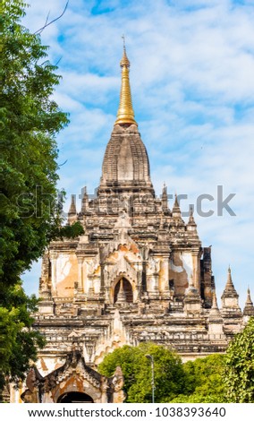 View of the facade of the building of the Shwegugyi temple in Bagan, Myanmar. Copy space for text. Vertical