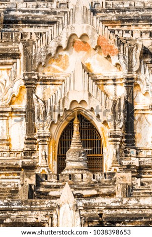 View of the facade of the building of the Shwegugyi temple in Bagan, Myanmar. Close-up. Vertical