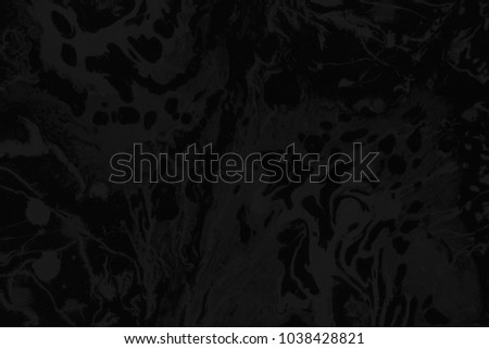 Dark black paint ombre leaks and splashes texture on white watercolor paper background. Natural organic shapes and design.