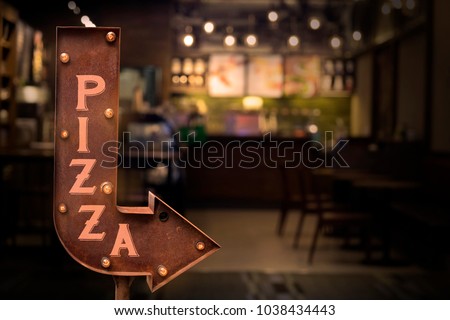 Pizza shop signboard, in front of the store
