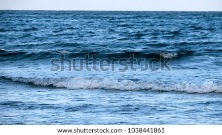 Sea water as background / A sea is a large body of salt water that is surrounded in whole or in part by land