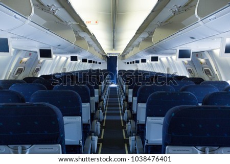 Picture of empty passenger seats inside airplane