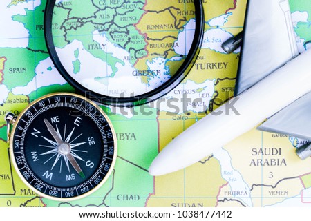 Compass on the map and travel ideas.