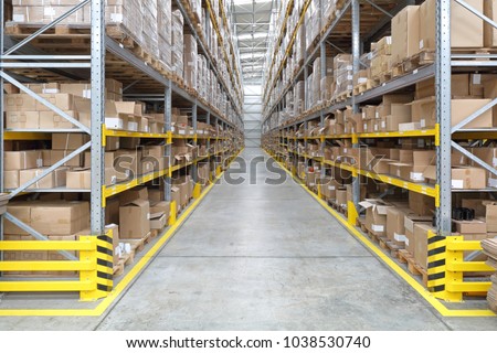 Long Aisle With Shelves in Fulfillment Warehouse Royalty-Free Stock Photo #1038530740